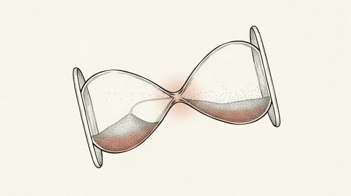 An engraving of a tipped hourglass with sand bottlenecked at its narrow neck